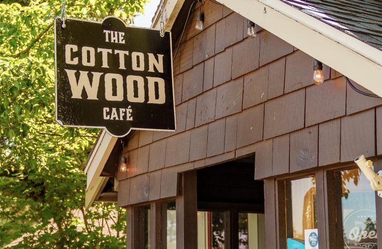 cottonwood cafe sign on a wooden cottage