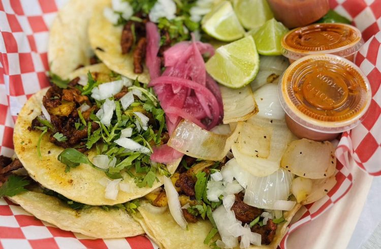 togo plate of tacos with lime wedges and salsa
