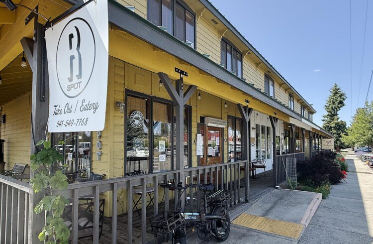 restaurant front porch with trees and parking