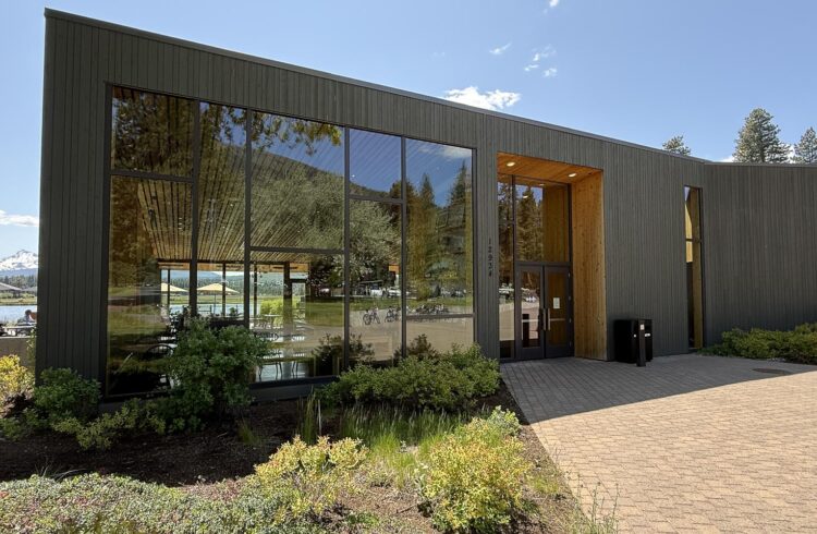 modern building with mountains in the background
