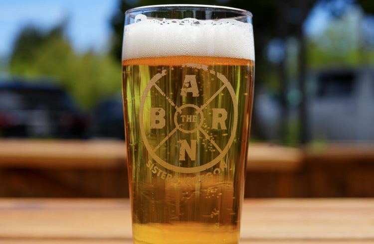 a beer on an outdoor patio table