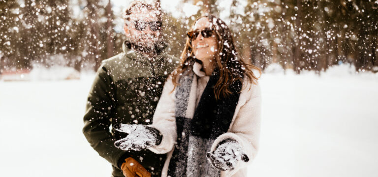 couple playing in the snow