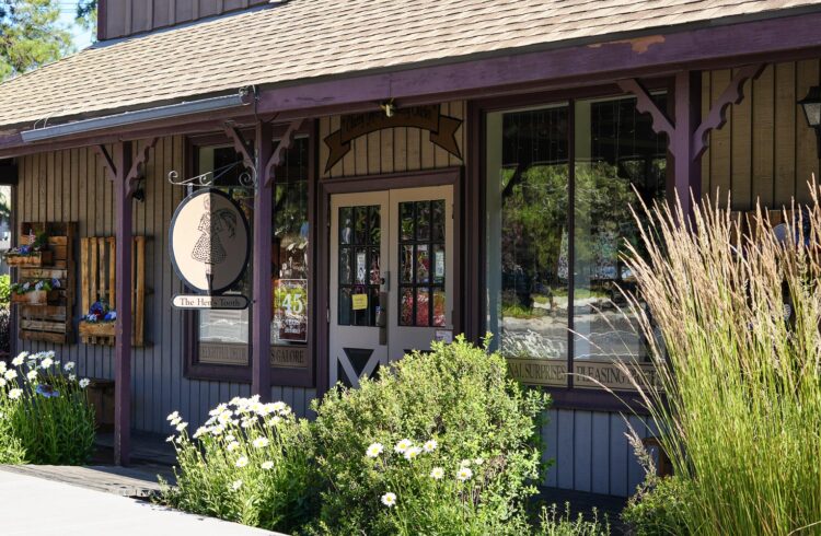 storefront with green grasses and landscaping in the front