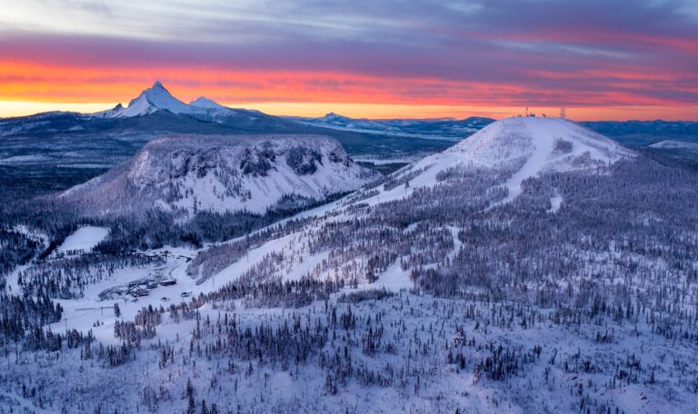 pink sunrise behind hoodoo