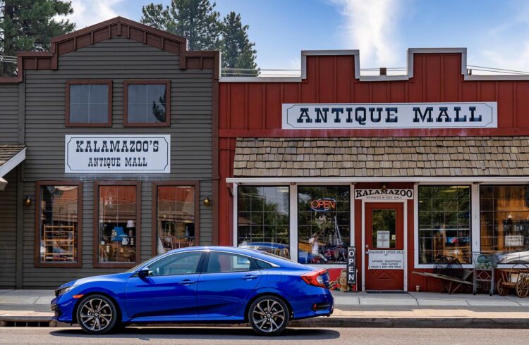 kalamazoo's antique mall exterior with blue car parked in front of