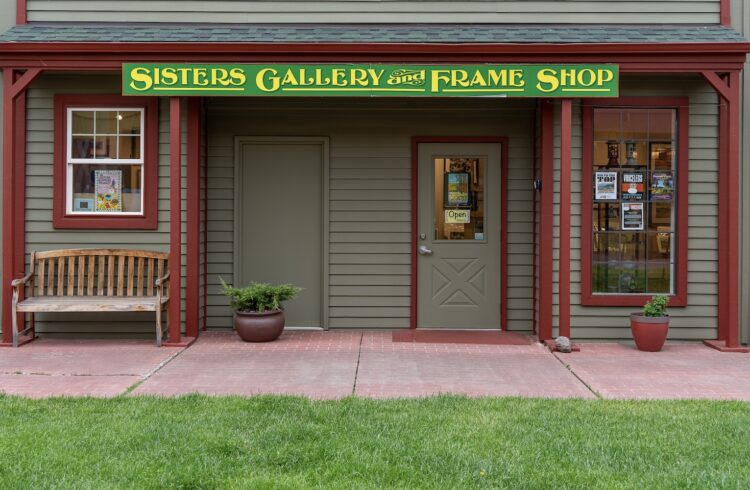 storefront with green grass in the foreground