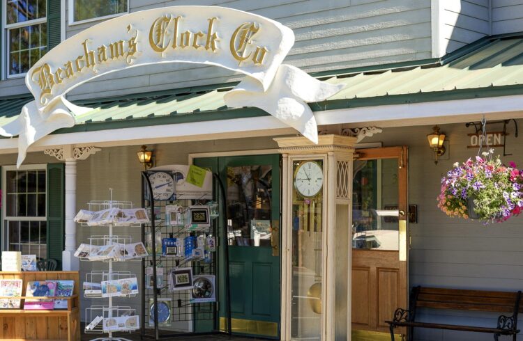 storefront with hanging flowers and outdoor display