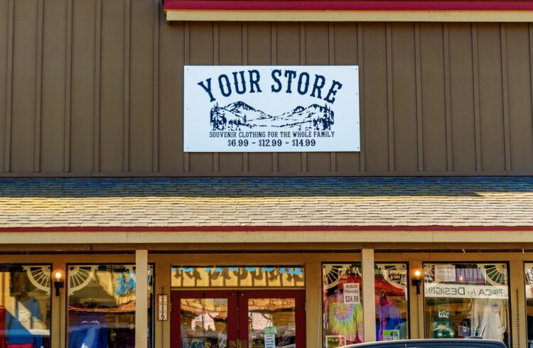 your store sign on a brown building