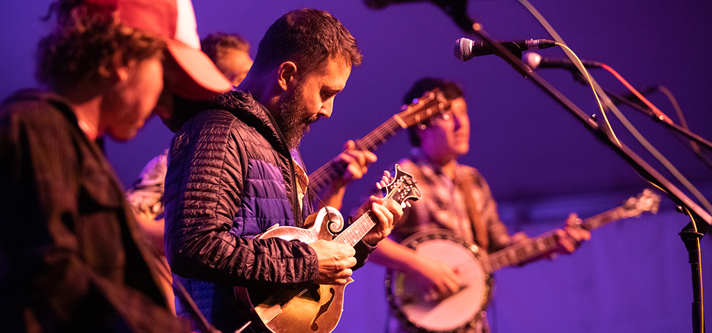 Band on stage at Sisters Folk Fest